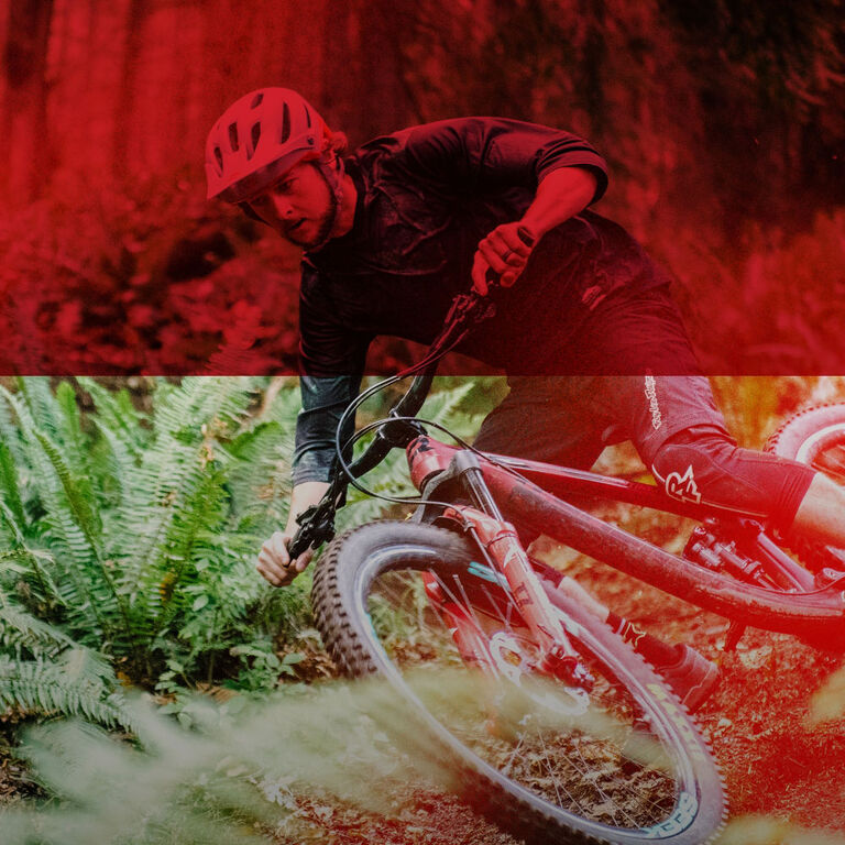 mountain biker with a red graphic treatment