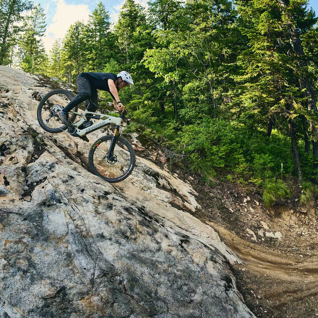 Man wearing 2twenty helmet, riding on a trail