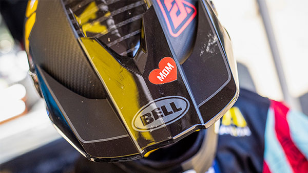 Top view of Vincent's Moto-10 helmet with a I Heart Mom sticker on the visor.