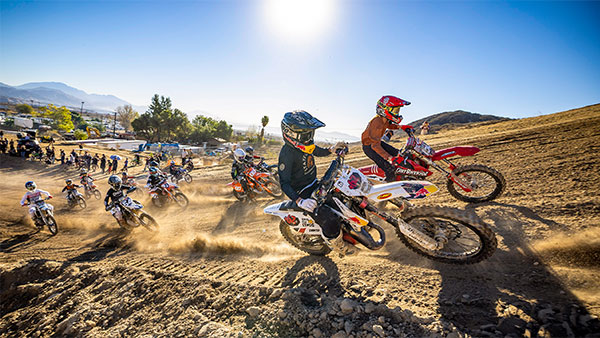 Riders racing up a hill