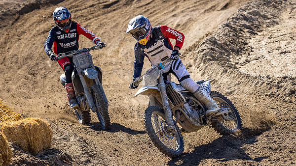 Two riders racing on the track