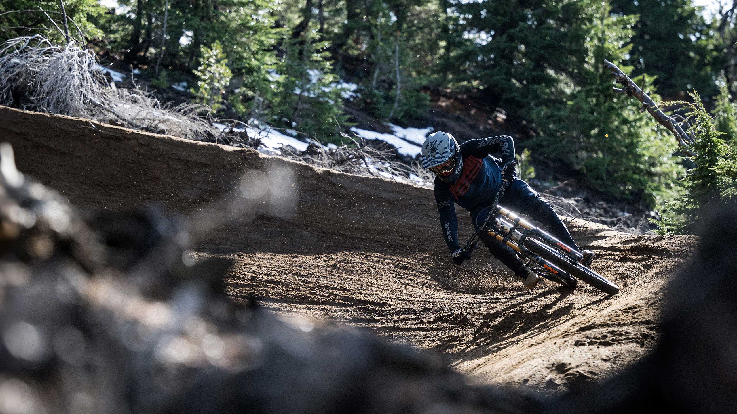 Biker wearing a Full-10 on a trail turn